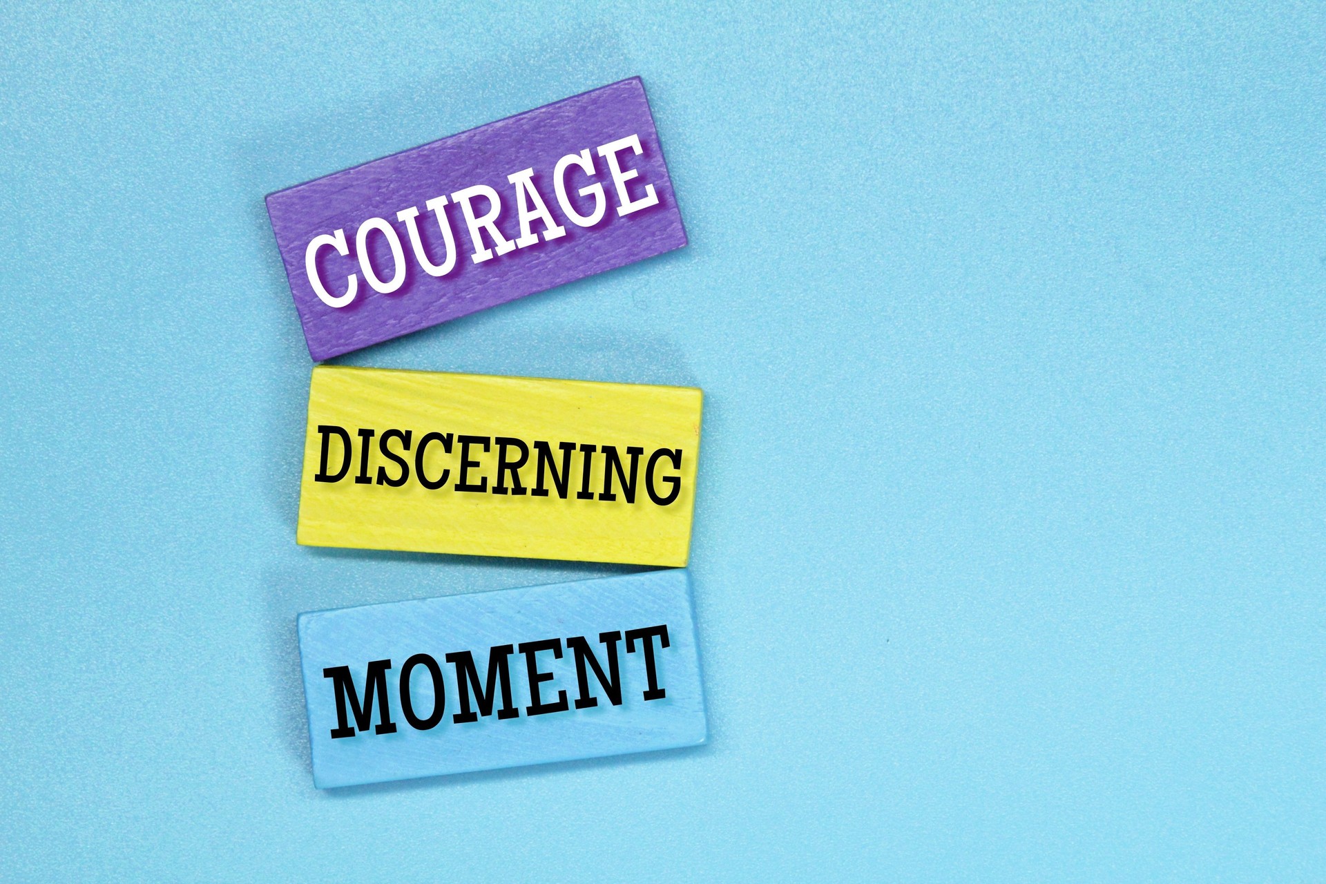 colored board with 3 Words Can Guide You to Success Courage, Discerning and Moment